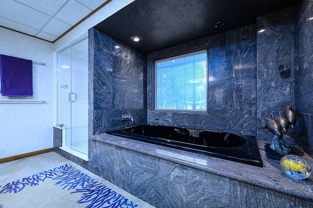 bathroom with tile patterned floors and plus walk in shower