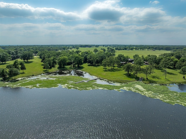 birds eye view of property featuring a rural view and a water view