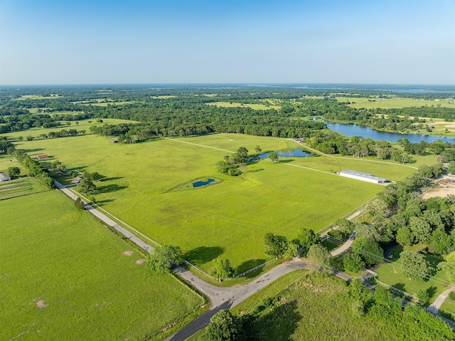 drone / aerial view with a rural view and a water view