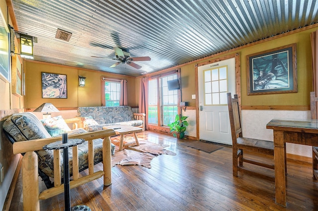 living room with ceiling fan, hardwood / wood-style floors, and crown molding