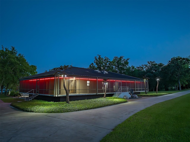 view of property exterior with a lawn