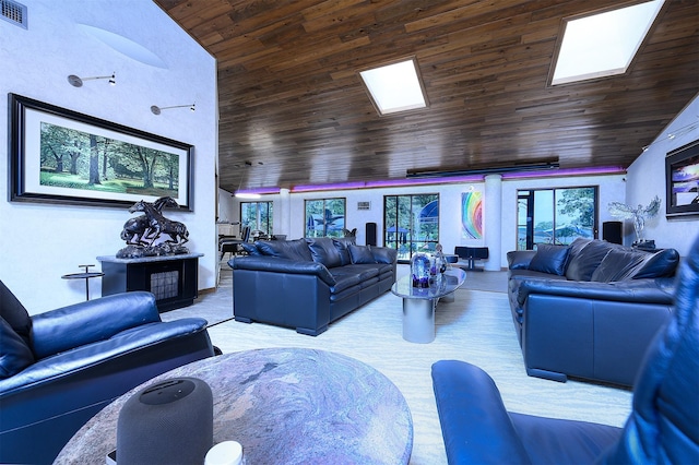 carpeted living room featuring a skylight and wooden ceiling