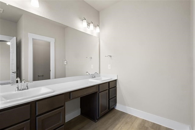 bathroom with vanity, hardwood / wood-style floors, and toilet