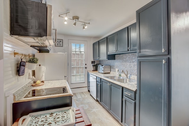 kitchen with light wood-type flooring, black electric stovetop, white fridge, dishwasher, and sink