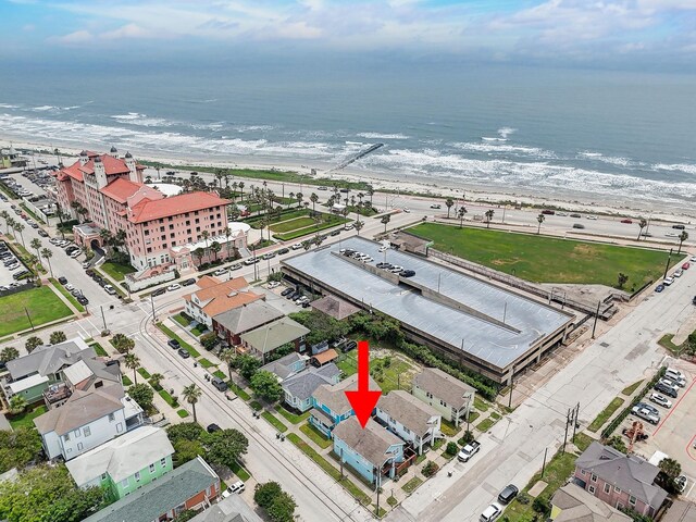 drone / aerial view with a view of the beach and a water view