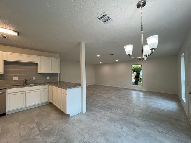 kitchen featuring white cabinetry, decorative light fixtures, backsplash, a chandelier, and light tile flooring