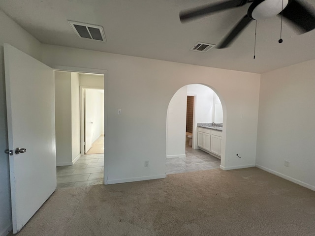 carpeted empty room with ceiling fan