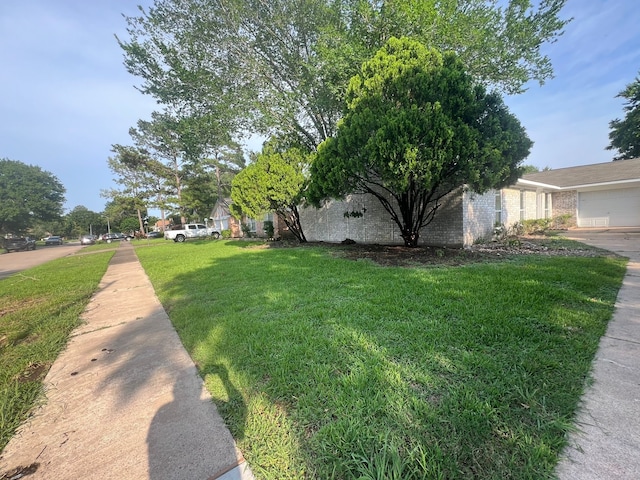 view of yard with a garage