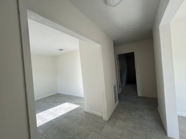 spare room featuring light tile flooring