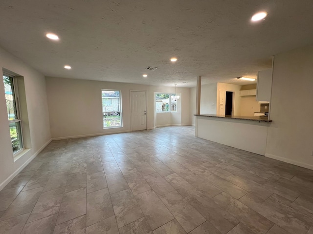 spare room with light tile floors