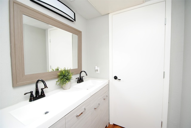 bathroom featuring vanity and hardwood / wood-style floors