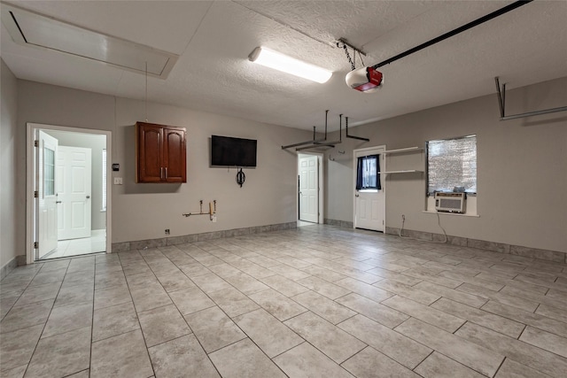 garage with a garage door opener and cooling unit