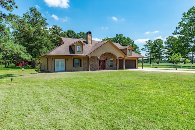 view of front of house with french doors, a front lawn, and a garage