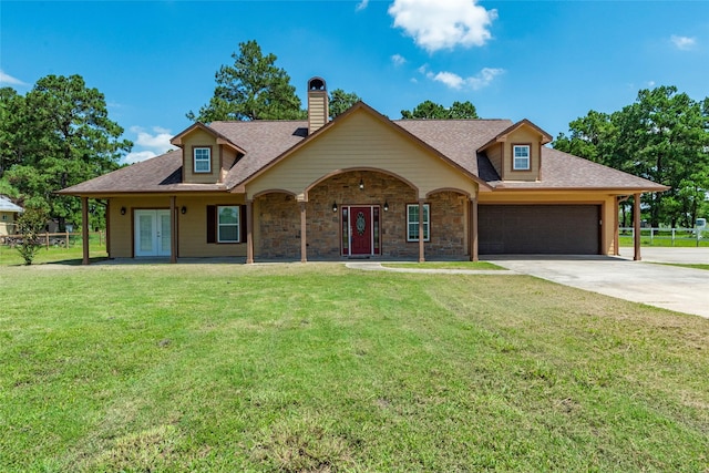 view of front of property with a garage and a front yard