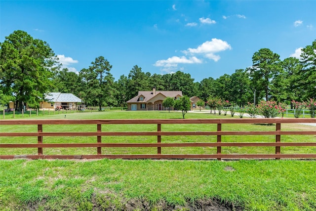 view of yard with a rural view