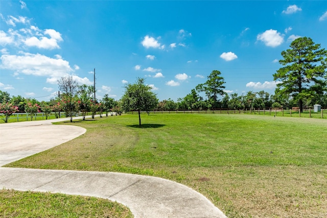 view of home's community with a yard and a rural view