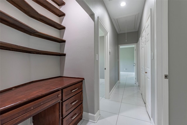 hall with light tile patterned floors