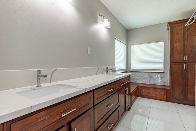 bathroom with vanity and tile patterned flooring