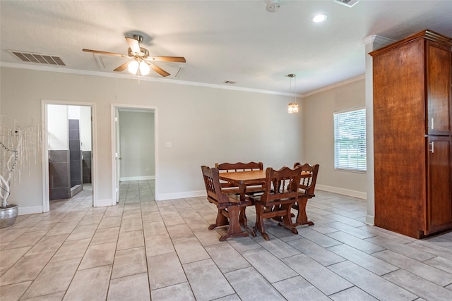 dining area featuring ornamental molding and ceiling fan