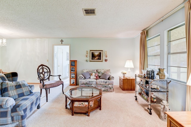 carpeted living room with a textured ceiling