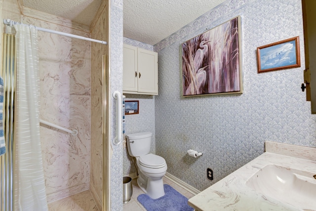 bathroom featuring walk in shower, vanity, a textured ceiling, and toilet