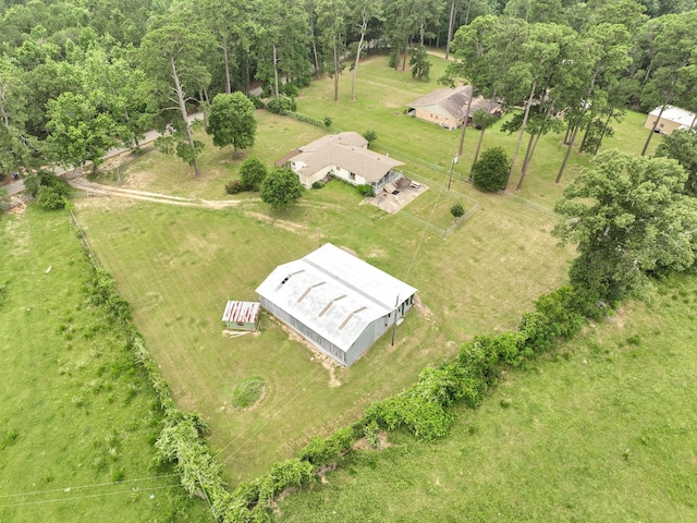 birds eye view of property with a rural view