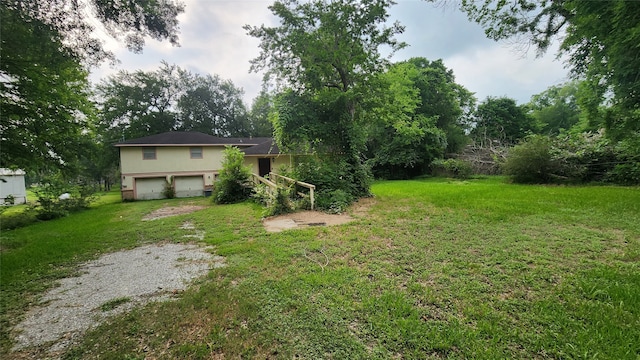 view of yard with a garage