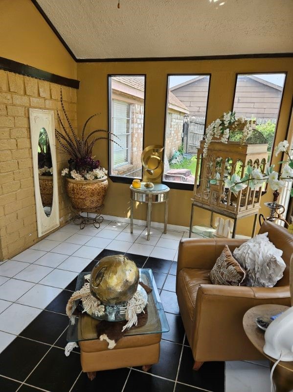 sunroom featuring lofted ceiling