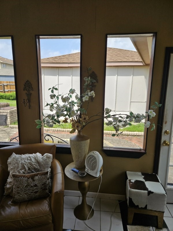 entryway with tile patterned floors and plenty of natural light