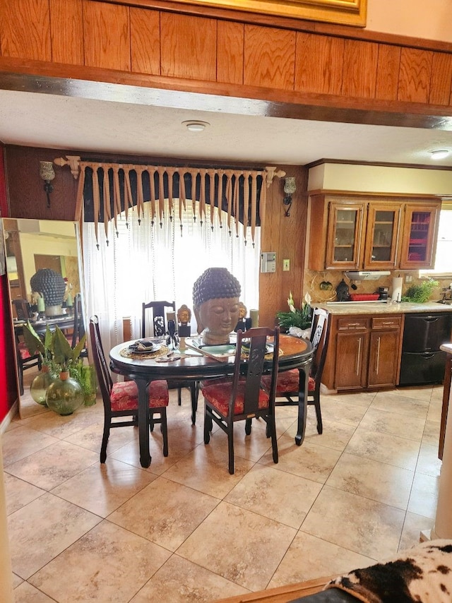 tiled dining area with wooden walls