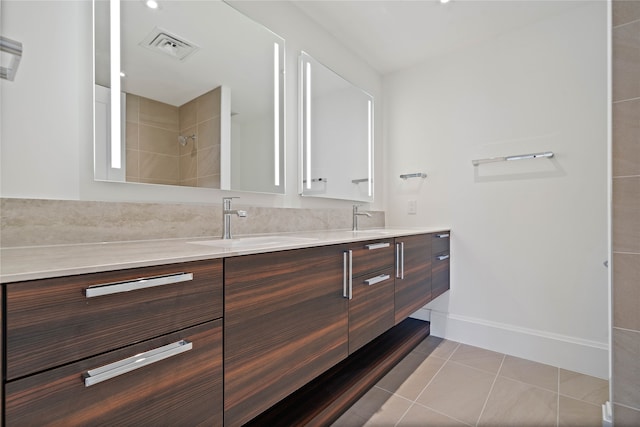 bathroom with tile patterned floors and vanity