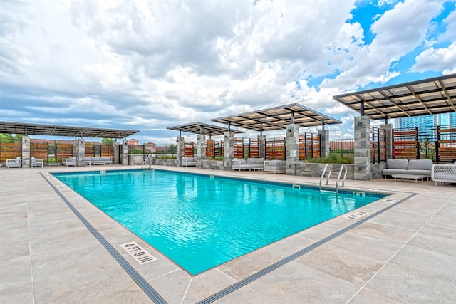 view of swimming pool with a patio area