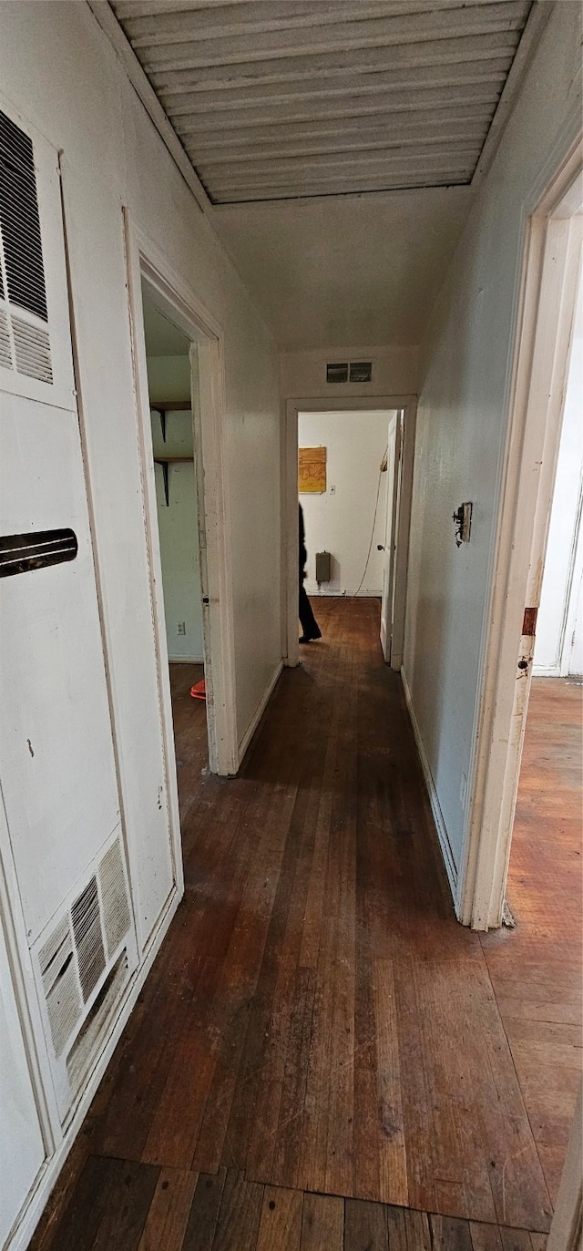 corridor featuring dark hardwood / wood-style floors