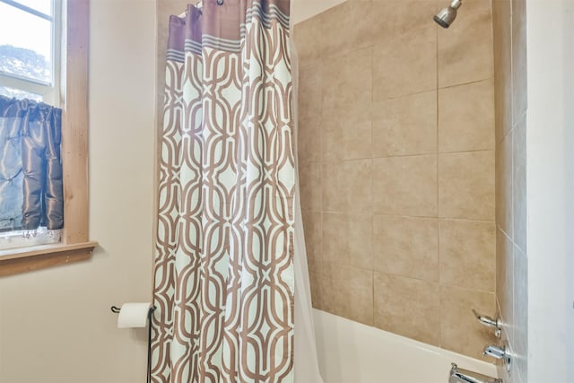 bathroom with shower / bathtub combination with curtain