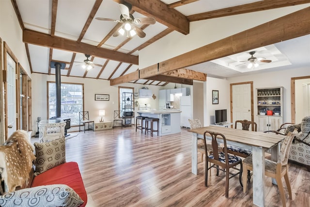 interior space with hardwood / wood-style flooring and lofted ceiling with beams