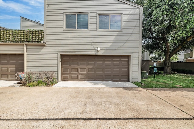 garage with concrete driveway