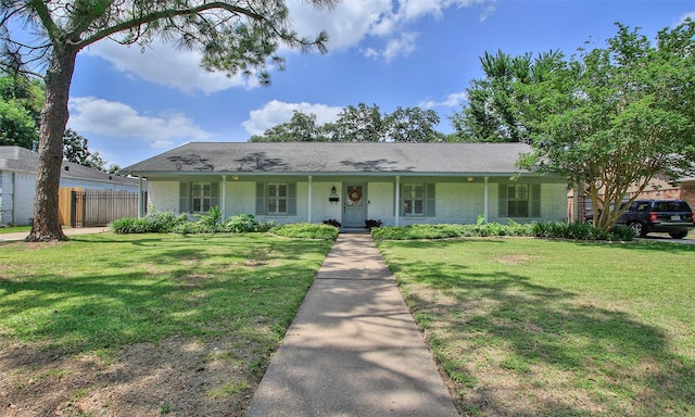 ranch-style home with a front lawn