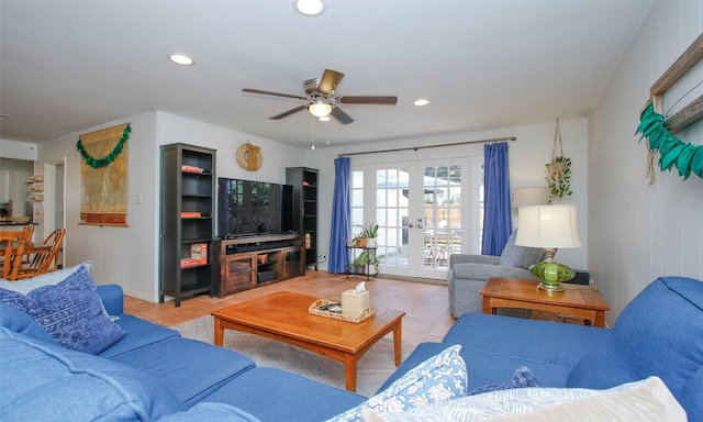 tiled living room with ceiling fan and french doors