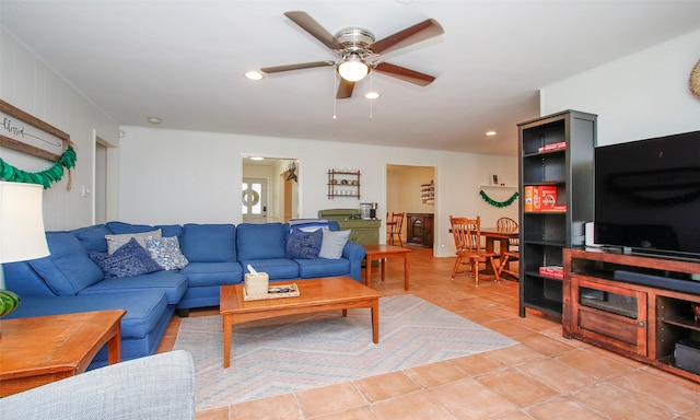 tiled living room featuring ceiling fan