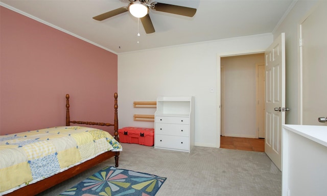 bedroom featuring ceiling fan, crown molding, and light carpet