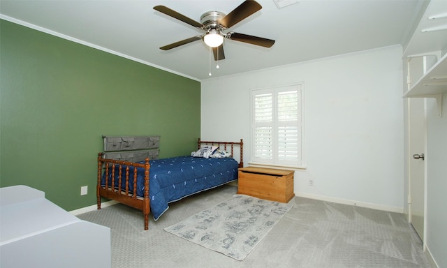 bedroom featuring carpet flooring, ceiling fan, and crown molding