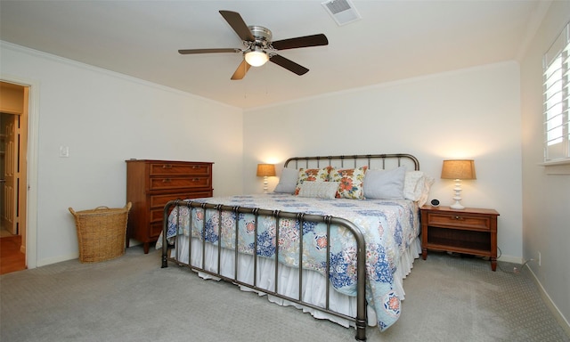 bedroom featuring ceiling fan, carpet floors, and crown molding