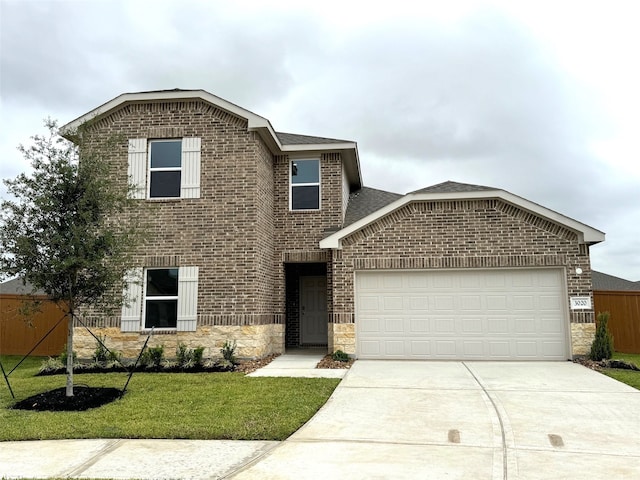 view of front property with a garage and a front lawn