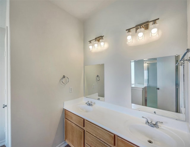 bathroom with a shower with door and vanity