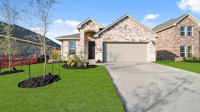 view of front of home with a garage and a front lawn