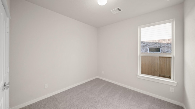 empty room with carpet flooring