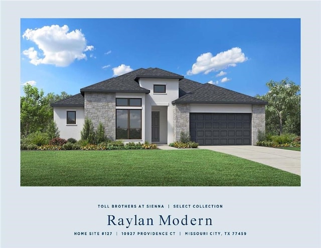 view of front of property with a front lawn and a garage