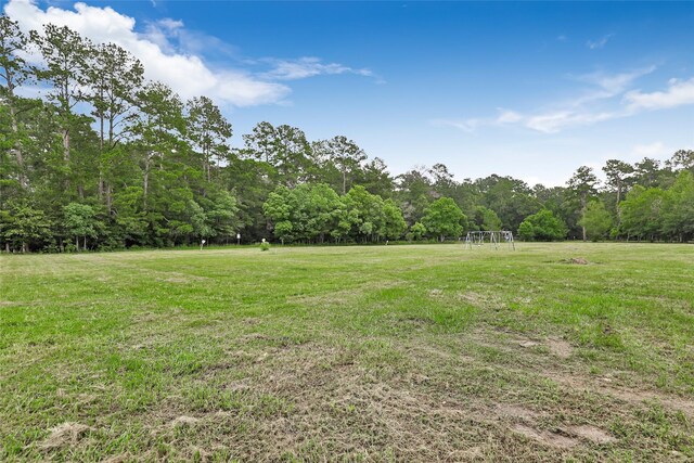 view of yard featuring a view of trees