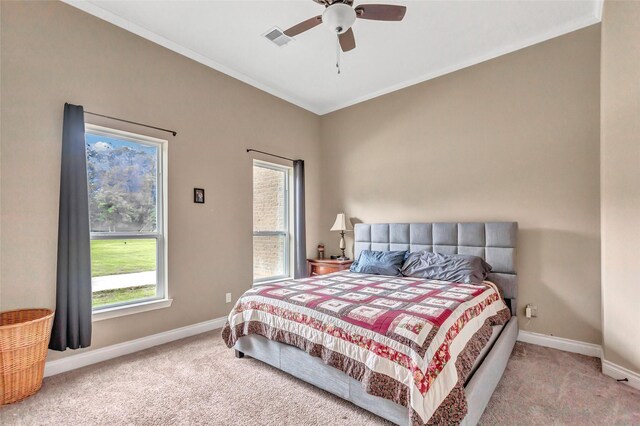 bedroom with crown molding, carpet, visible vents, and baseboards