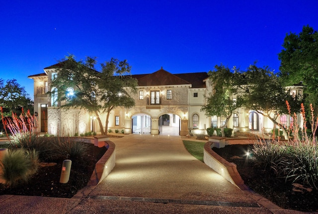 mediterranean / spanish-style home with french doors and stucco siding